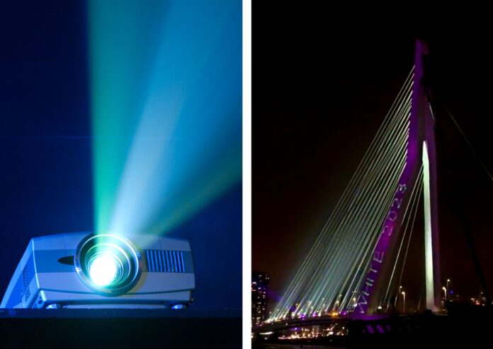 composite-image-of-projector-and-words-white-2023-projected-on-erasmus-bridge