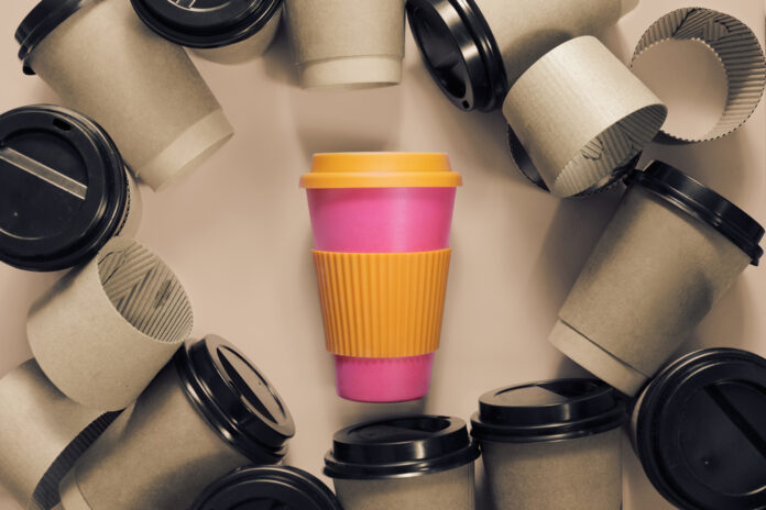 reusable-coffee-cup-surrounded-by-single-use-ones