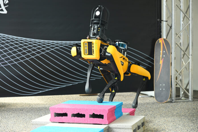 robot-dog-yellow-standing-on-obstacle
