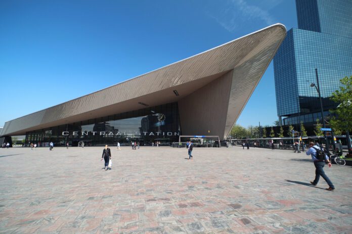 Front-entrance-of-the-international-train-station-of-Rotterdam-Centraal-station-in-wide-angle-on-a-sunny-day