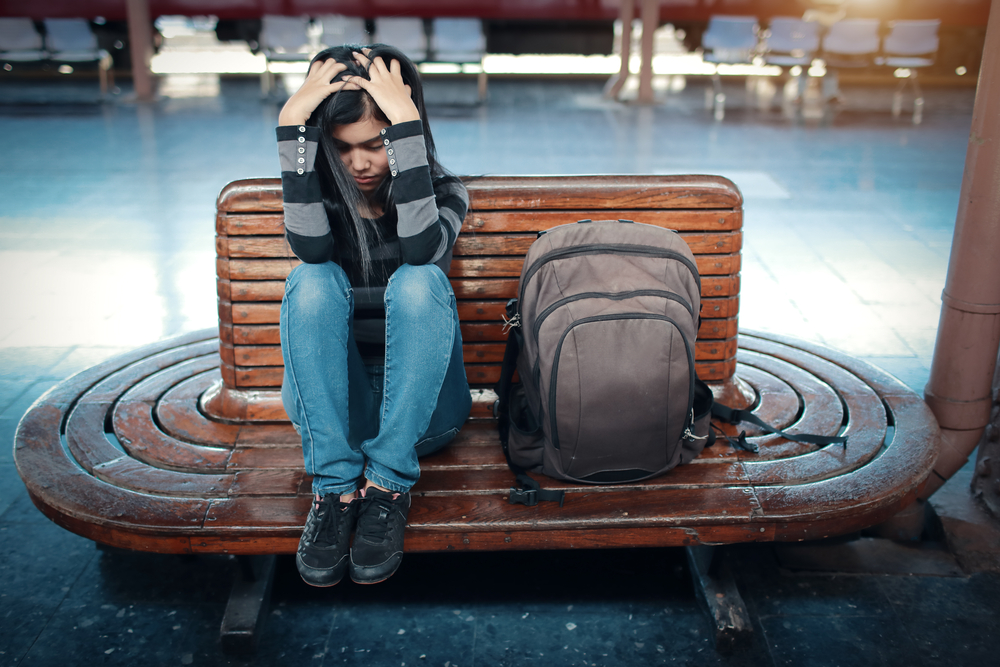 sad-student-sitting-on-a-bench