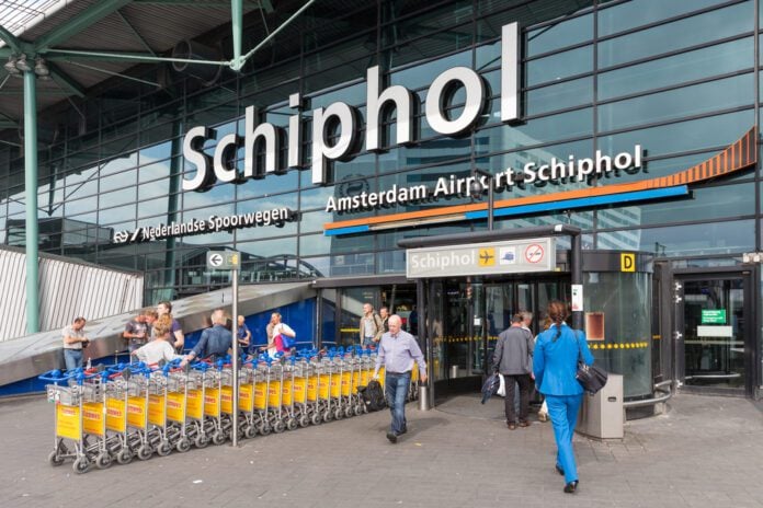 Schiphol-airport-Amsterdam-entrance-with-passing-travellers