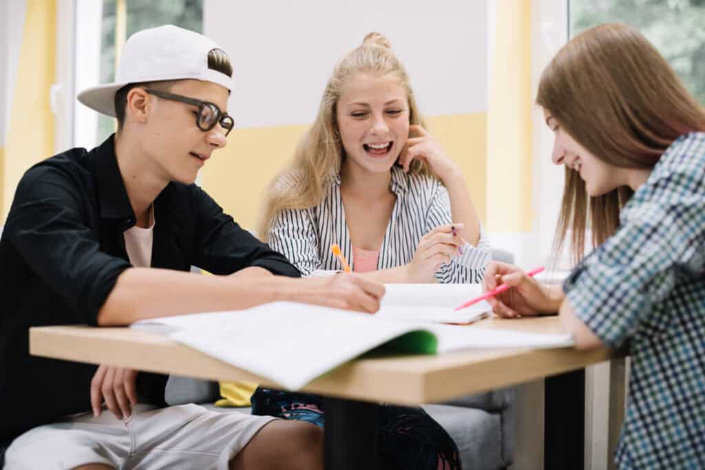 secondary-school-students-at-a-dutch-international-school-sit-and-work-on-an-assignment