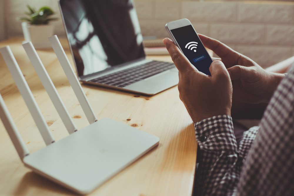 photo-of-person-setting-up-wifi-as-part-of-things-to-do-when-moving-house-in-Netherlands