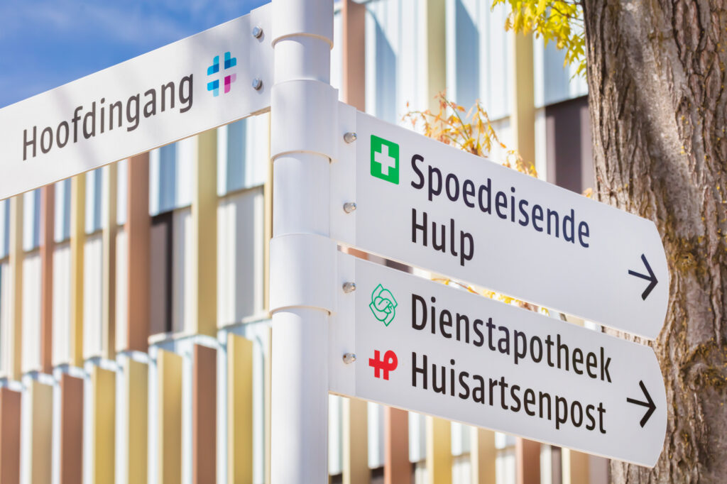 photo-of-sign-pointing-to-different-parts-of-dutch-hospital