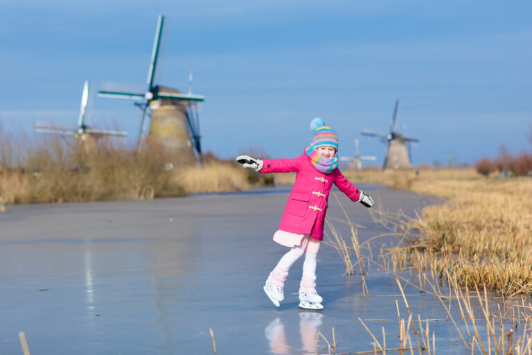 a-picture-of-a-little-girl-skating-on-frozen-canal-netherlands