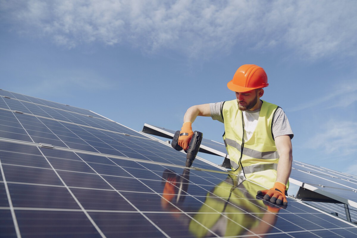 photo-of-a-man-installing-solar-panels-on-a-house-in-the-netherlands