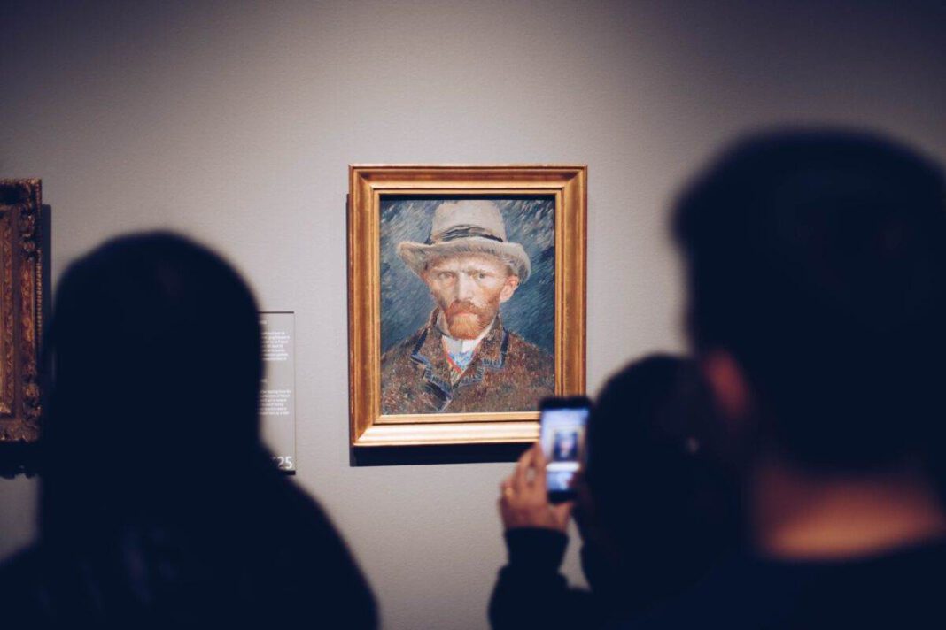 photo-of-people-looking-at-the-van-gogh-self-portrait