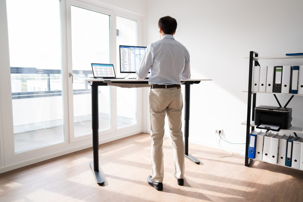 Man Working On Computer At Standing Desk in the Netherlands