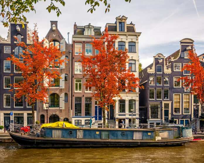 boat-in-a-canal-in-amsterdam-during-autumn