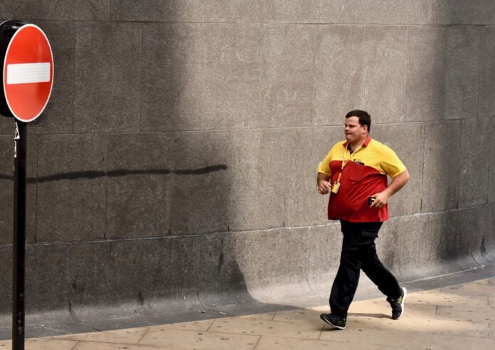 DHL delivery person running