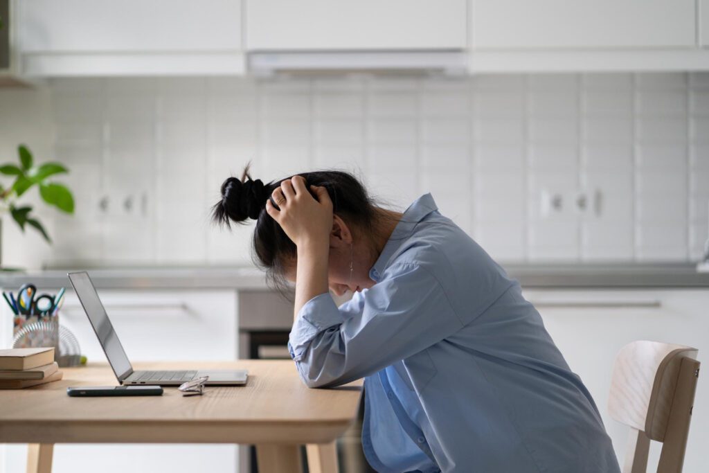 photo-of-stressed-woman-at-desk