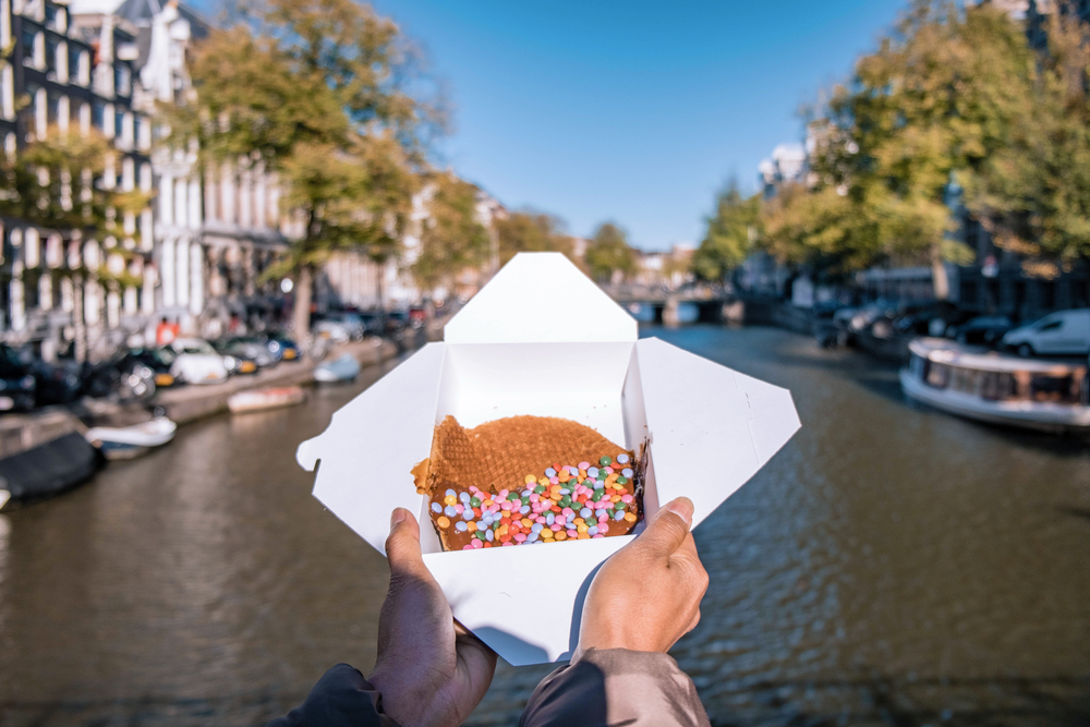 Stroopwafel in Amsterdam is typical Dutch food two circular pieces of waffle filled with a caramel syrup