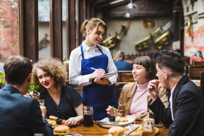 photo-of-waitress-taking-order-at-restaurant