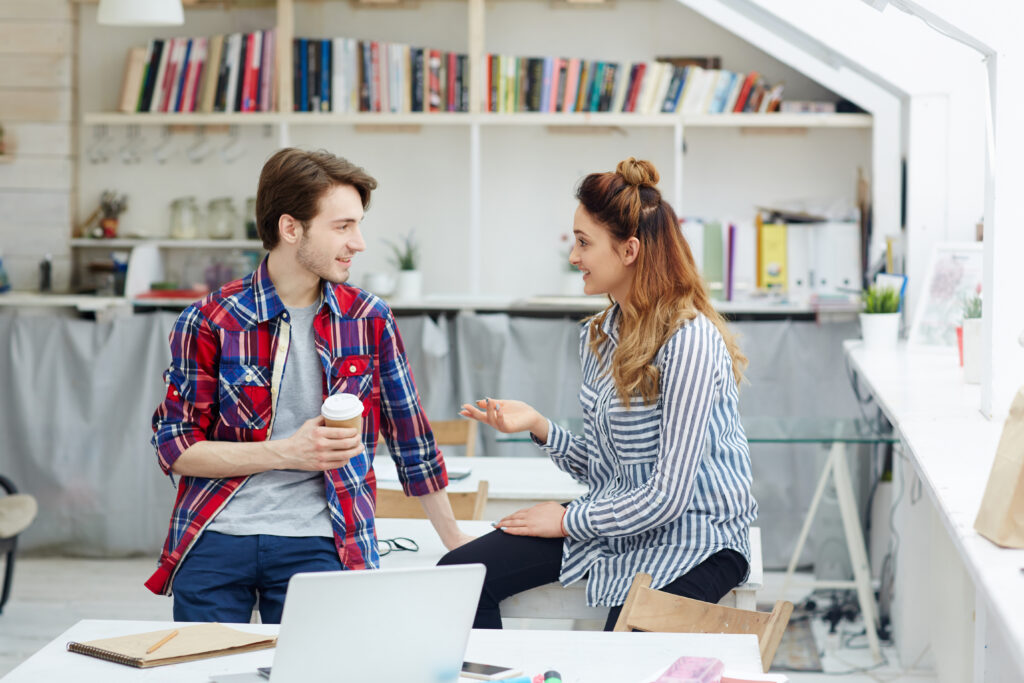 A-man-and-a-woman-talking-at-a-office-the-woman-answering-a-question