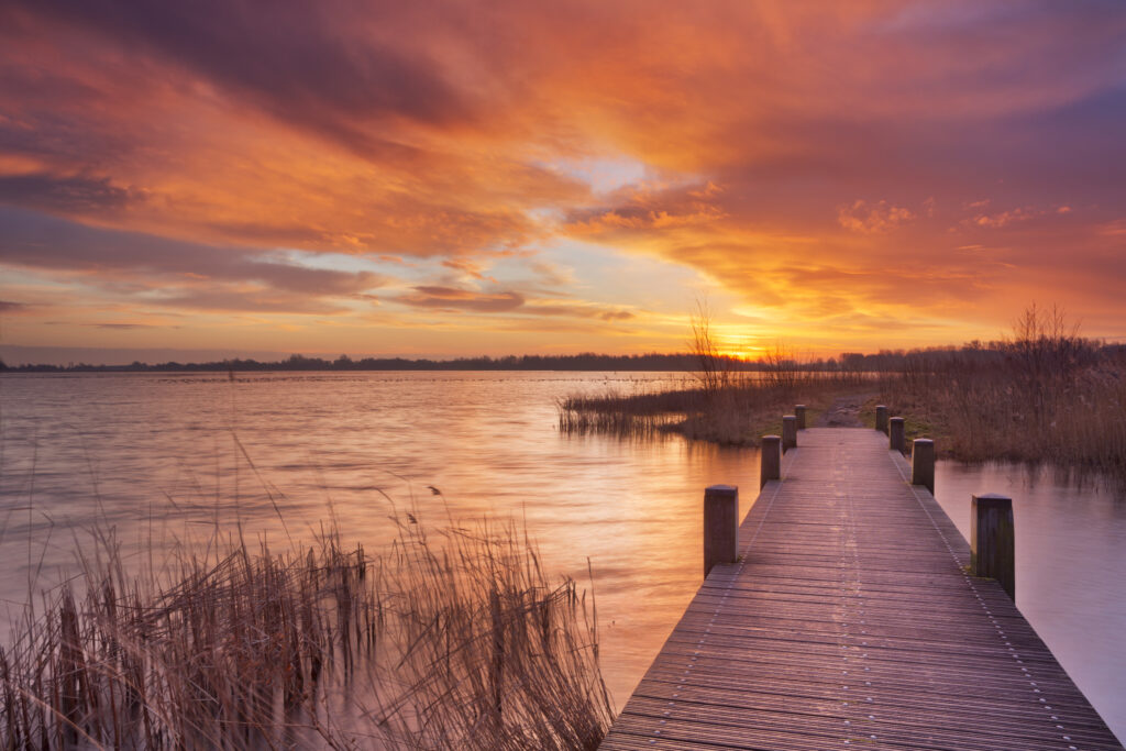 sunrise-over-bridge-and-water-on-hike-through-zaanstreek-in-twiske-nature-reserve