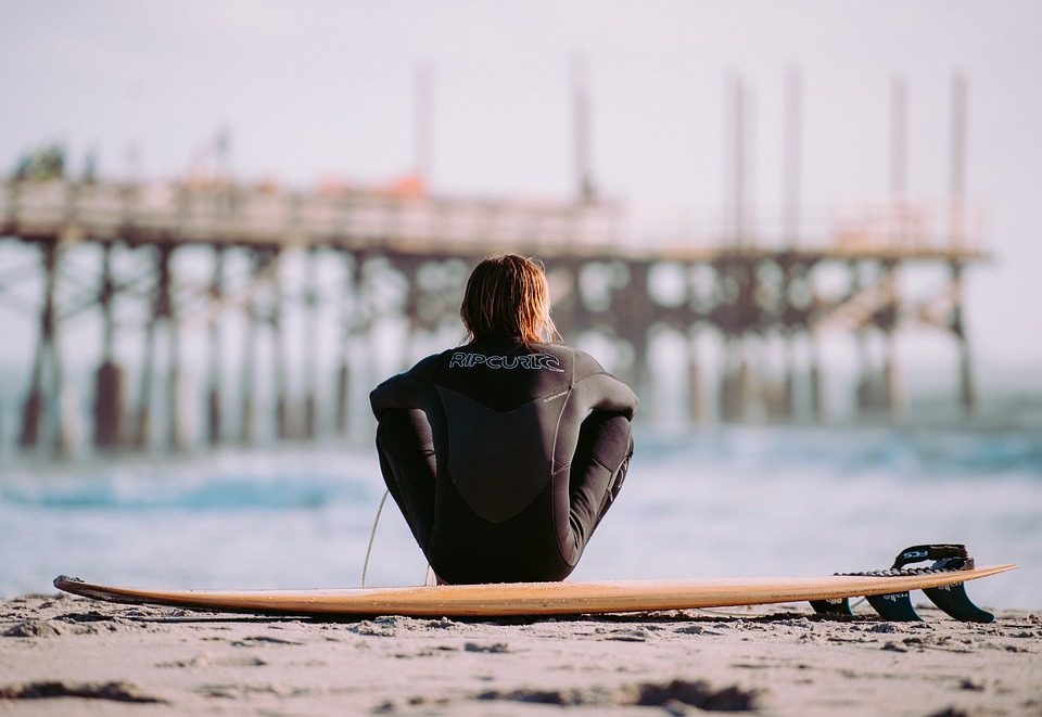 Surfer about to go for a paddle