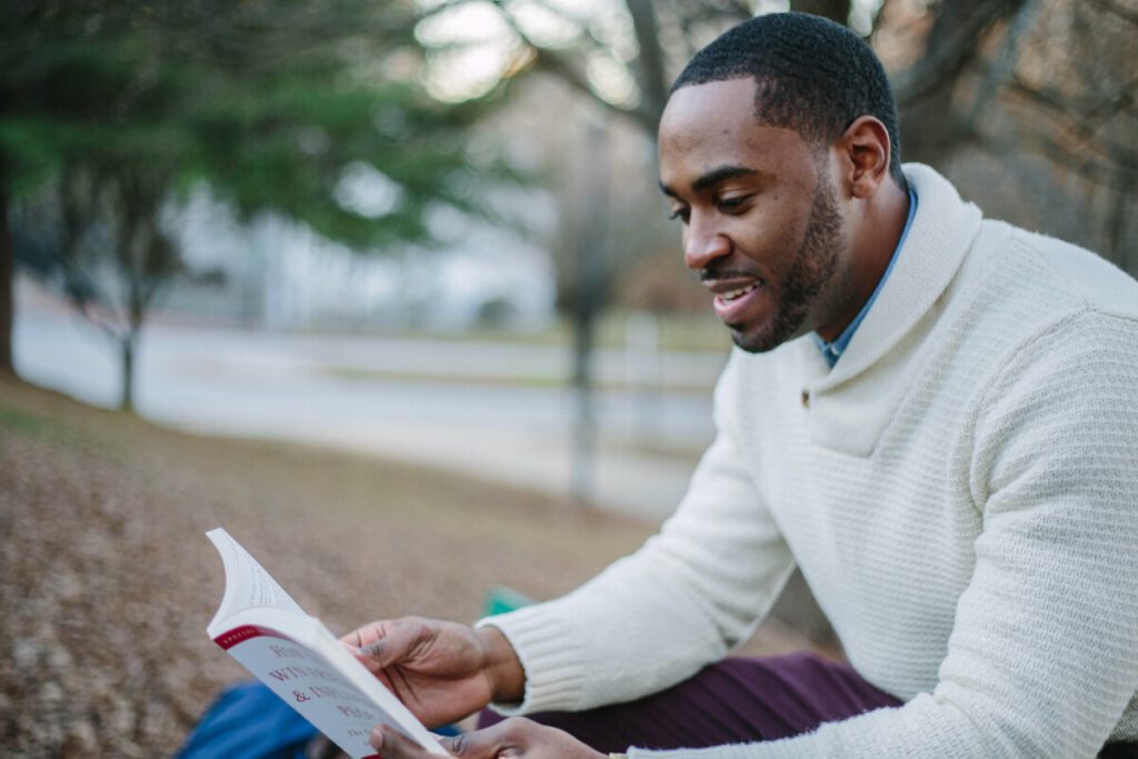 Photo-of-man-holding-book-learning-Dutch