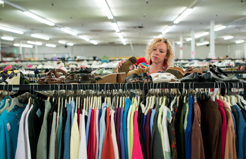 Woman-shopping-for-clothes-at-a-thrift-shop-in-the-netherlands