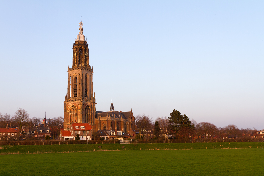 photo-the-cunerakerk-seen-from-the-fields-at-sunrise