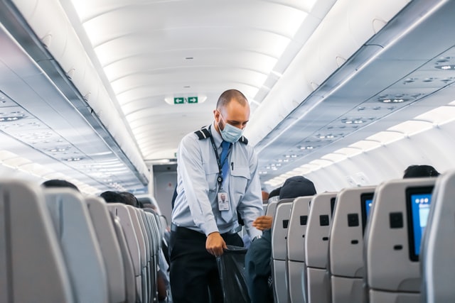 photo-of-travel-attendant-in-a-mask