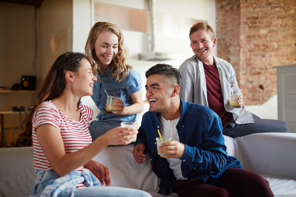 two-couples-laughing-and-having-drinks-together