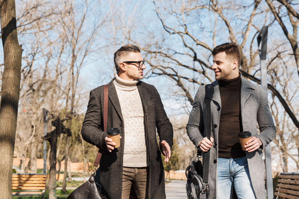 two-men-walking-in-park-practicing-speaking-dutch