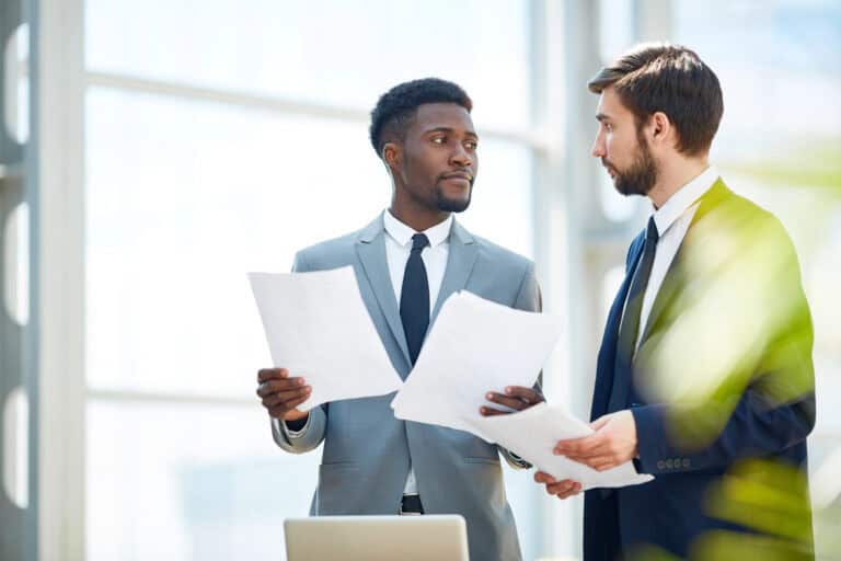 photo-of-two-men-discussing-things-to-check-on-your-dutch-employment-contract