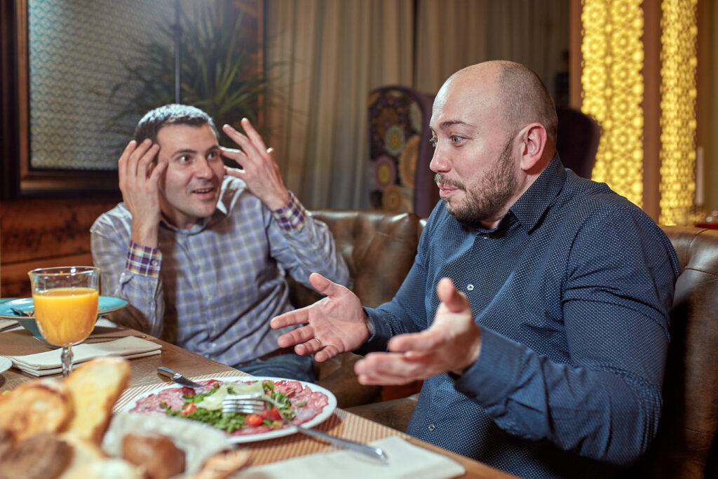 two-men-in-restaurant-arguing