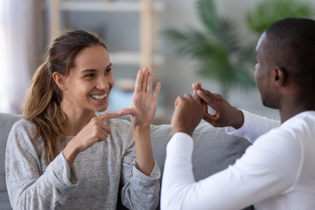 
two-people-in-the-netherlands-talking-to-each-other-in-sign-language