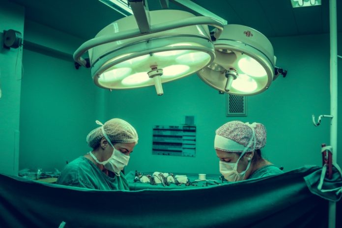 two doctors operating on cancer in the netherlands