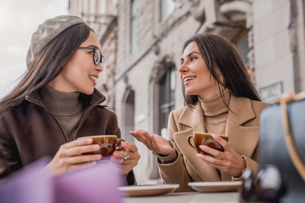 Two-young-women-drinking-coffee-at-a-Dutch-cafe