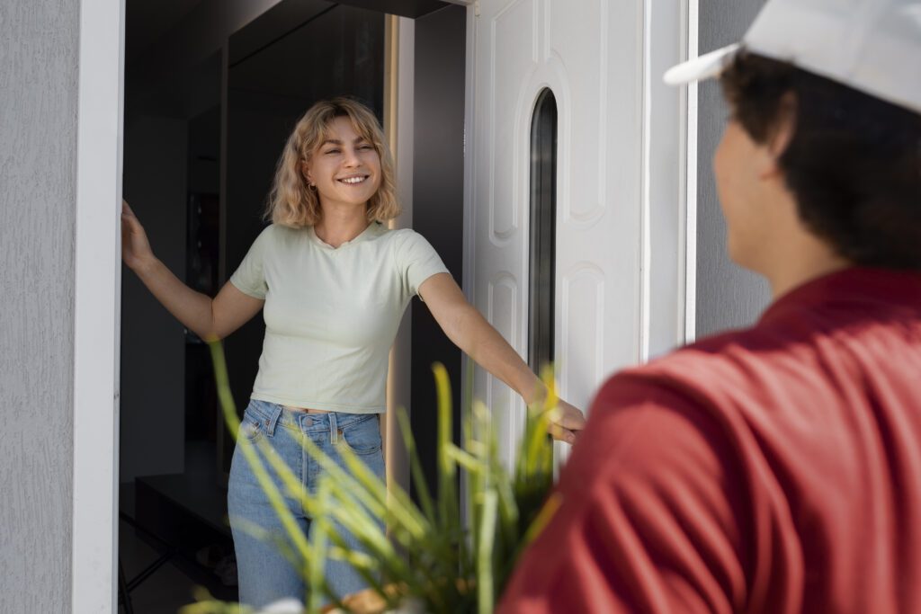 woman-greeting-man-at-her-door-netherlands-uninvited-guests