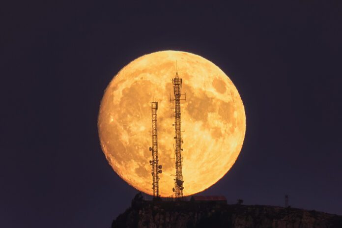 photo-of-supermoon-behind-two-antennae-rare