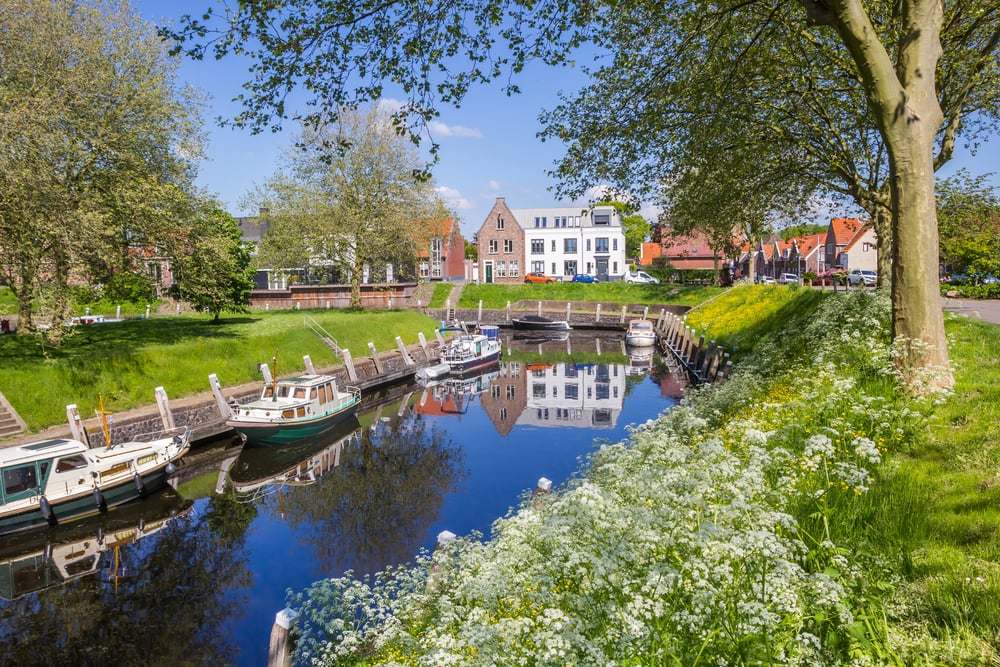 view-of-a-canal-with-boats-in-the-historic-city-of-vollenhove
