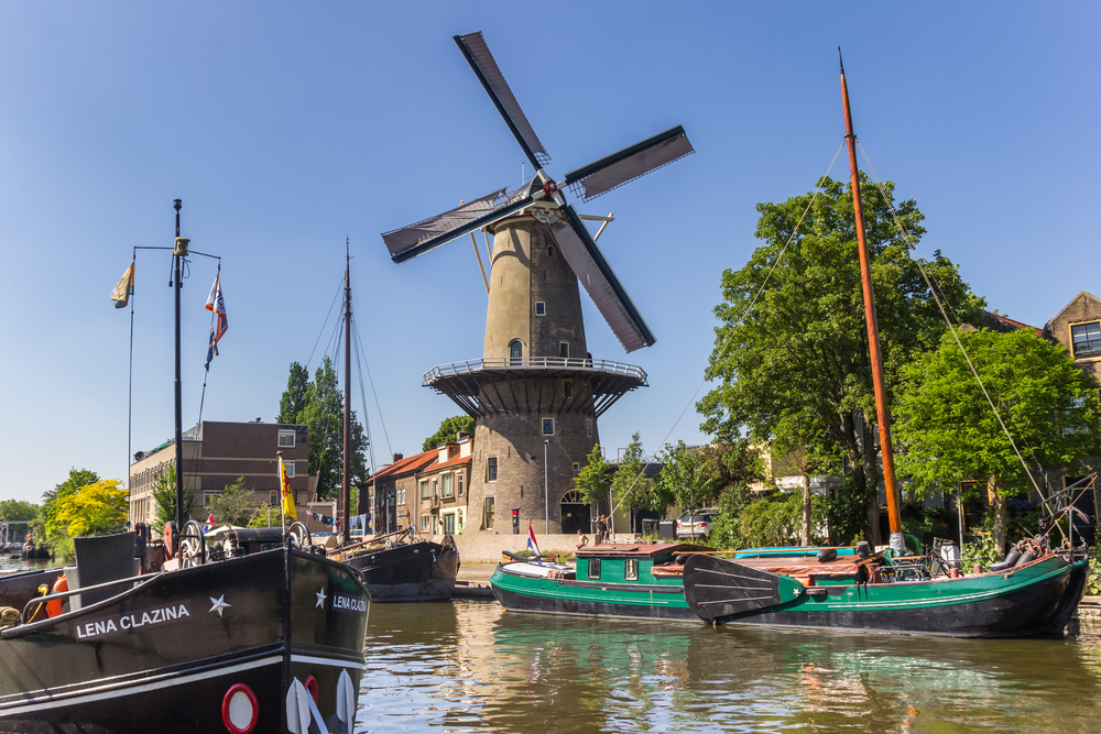 photo-of-red-lion-windmill-thing-to-do-in-gouda-on-a-sunny-day