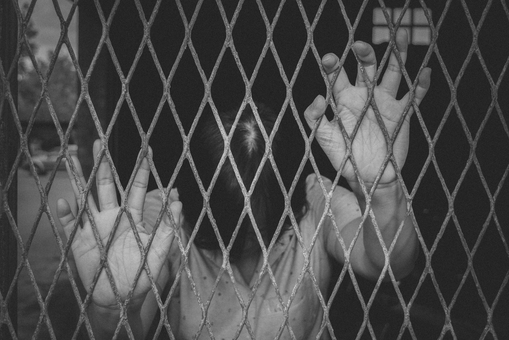 woman-behind-bars-penitentiary