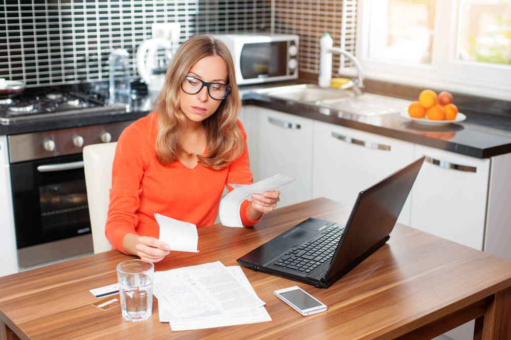 picture-of-woman-sorting-through-bills