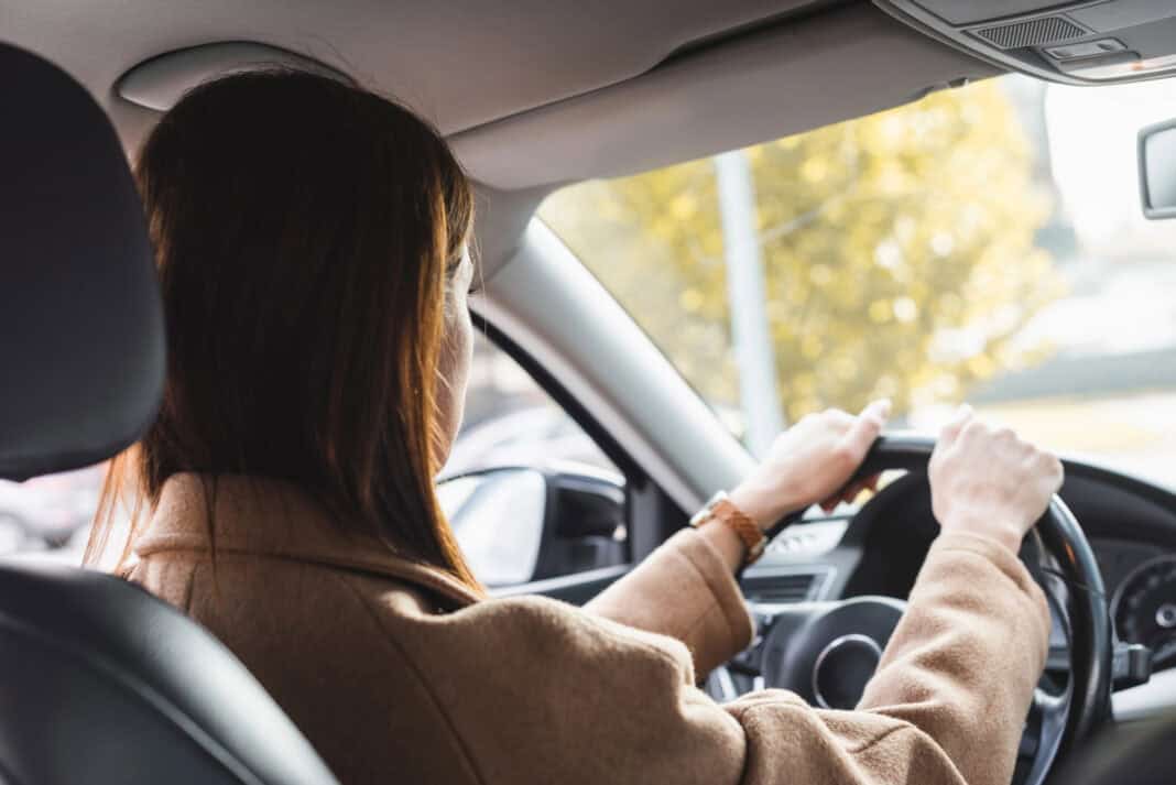 photo-of-a-woman-driving-from-the-back
