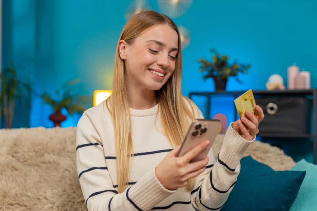 woman-holding-dutch-bank-card-while-switching-banks-via-netherlands-overstapservice-bank-switching-service