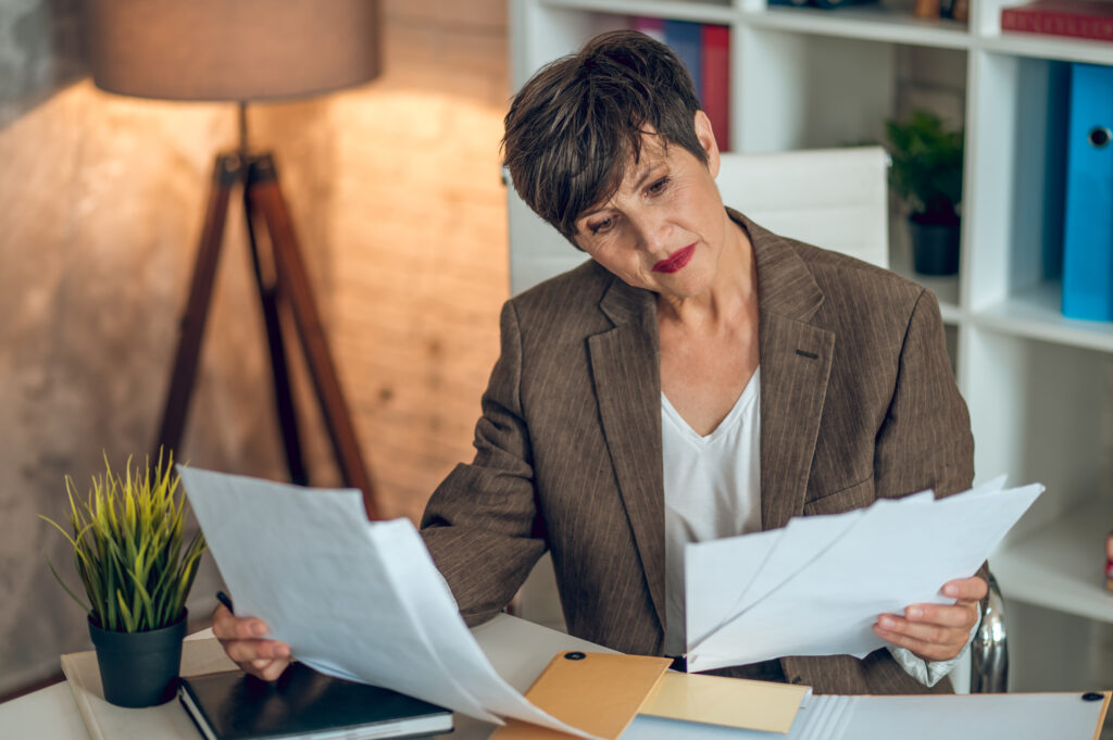 woman-in-the-netherlands-reaeding-through-the-paperwork-involved-to-set-up-a-dutch-business