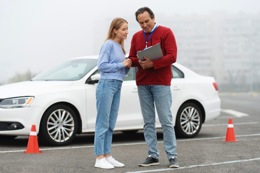 photo-of-female-taking-drivers-lesson-standing-outside-car-with-instructor-looking-at-clipboard-in-netherlands