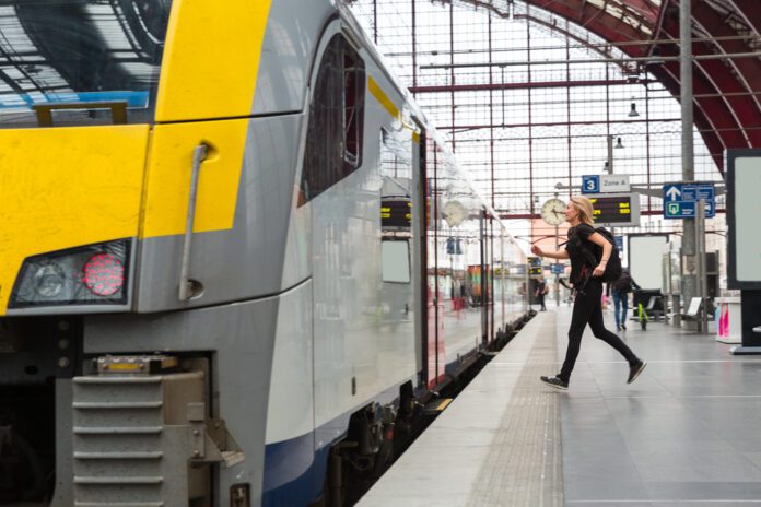photo-of-woman-running-to-make-train-connection-eu-rail-rules