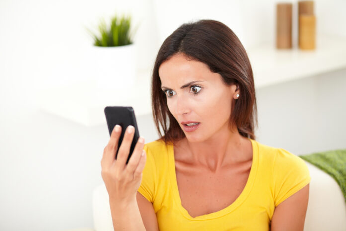 woman-shocked-at-her-phone