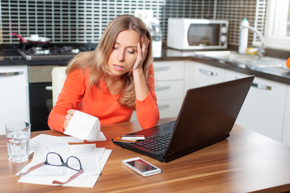 photograph-of-a-woman-stressed-out-about-getting-a-fine-for-not-taking-out-dutch-health-insurance