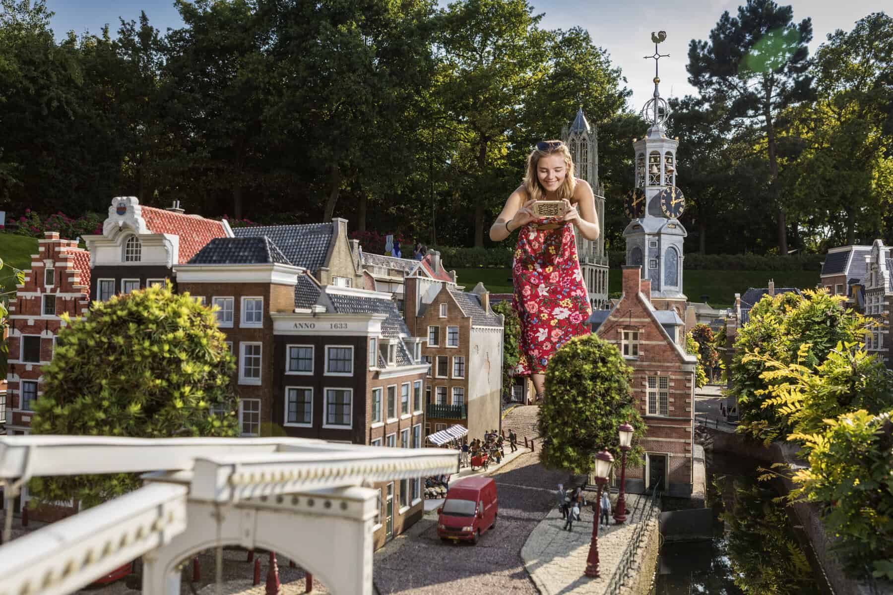 photo-of-woman-walking-among-miniatures-at-madurodam-in-the-hague