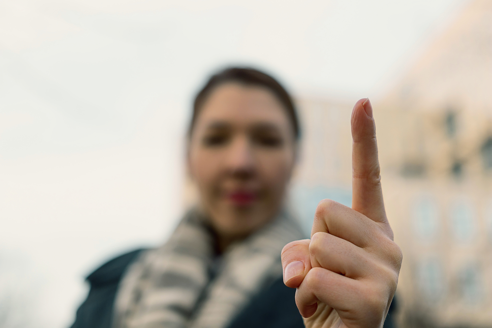 picture-of-a-woman-sending-warning-with-finger
