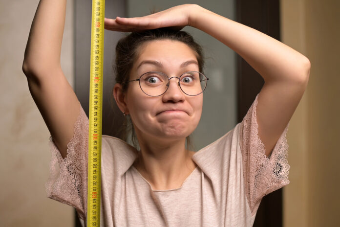 picture-of-woman-next-to-measuring-tape