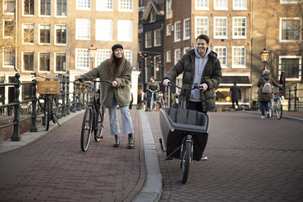 young-adults-using-sustainable-e-bikes-from-Upway-in-amsterdam-netherlands