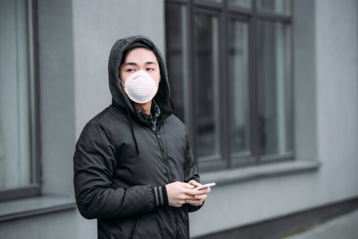 young-asian-man-wearing-mask-and-hoodie